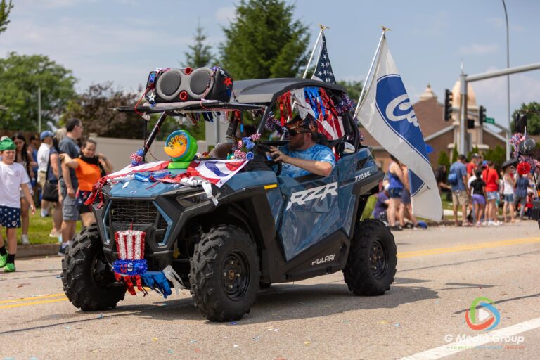 CAROL STREAM, Ill. — July 4, 2026: Participants march down the parade route during the annual Carol Stream Independence Day Parade in Carol Stream, Ill., Saturday, July 4, 2026. Despite a week-long regional heat wave, the community-funded tradition—a village staple since 1987—drew large crowds for the nearly two-hour event, which honored local military veterans as the collective Grand Marshal. (GMedia Group/Zachary Gebis)