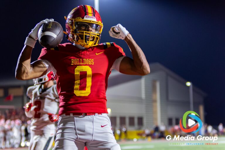 Batavia's DARIN ASHIRU (#0) celebrates in the endzone after scoring a touchdown against Maine South in Batavia, Illinois, on August 21, 2026. Batavia defeated Maine South 49-35 in the season opener.
