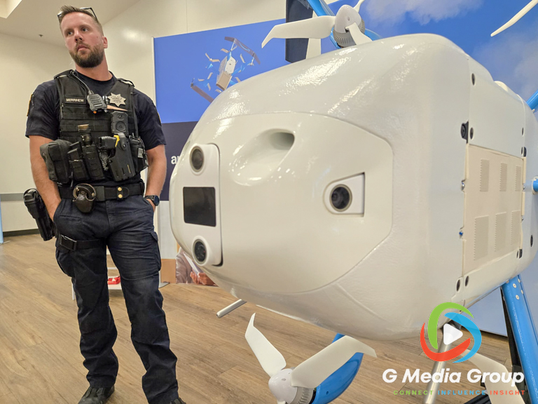 Naperville Police Officer Merrihew asks questions about the Amazon MK30 delivery drone during an Amazon Prime Air public open house at the ARC in West Chicago on Sept. 24, 2026.