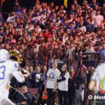 A sea of Geneva High School students watch intently from the bleachers during the fourth quarter of the football game against Batavia at Batavia High School in Batavia, Ill., on September 25, 2026. The atmosphere remained tense as Geneva held onto a narrow lead in a game that featured 105 total points.