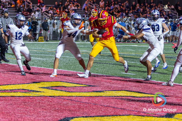 Batavia wide receiver Brennon Zeng (14) breaks past defender coverage to score his second touchdown of the evening against Lake Park High School at Batavia High School in Batavia, Ill., on September 11, 2026.