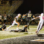 Batavia senior quarterback Michael Vander Luitgaren (#8) darts into the end zone while pursued by Glenbard North defenders during a high school football game at Glenbard North High School in Carol Stream, IL, on September 04, 2026.