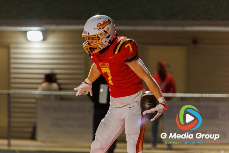 Batavia running back Charlie Rosengren (#7) celebrates in the endzone after scoring the game's opening touchdown during a varsity football matchup against Wheaton Warrenville South at Bulldog Stadium in Batavia, Illinois, on October 16, 2026.