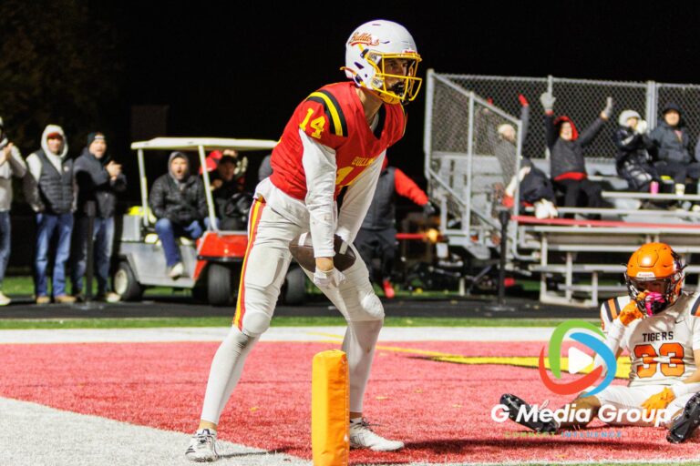 Batavia player Zeng (#14) celebrates in the endzone after scoring a fourth-quarter touchdown against Wheaton Warrenville South at Bulldog Stadium in Batavia, Illinois, on October 16, 2026.