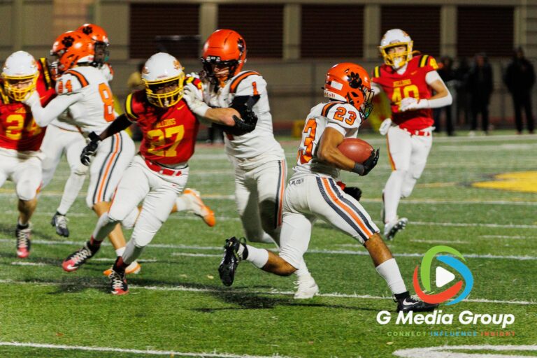 Wheaton Warrenville South running back Trent Simpson (#23) carries the ball downfield during late-game action against Batavia during a varsity football matchup at Bulldog Stadium in Batavia, Illinois, on October 16, 2026.