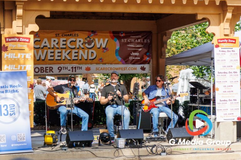 Acoustic rock group 13 Days performs live under the gazebo stage during the 41st annual Scarecrow Weekend on Saturday, Oct. 10, 2026, in St. Charles, Ill.